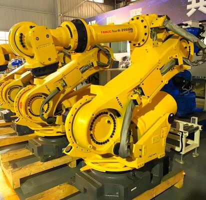 FANUC Laser Cutting Cell with Automatic Loading/Unloading and Turn Table for Mass Production of 3D Metal Workpieces in Automotive Industry